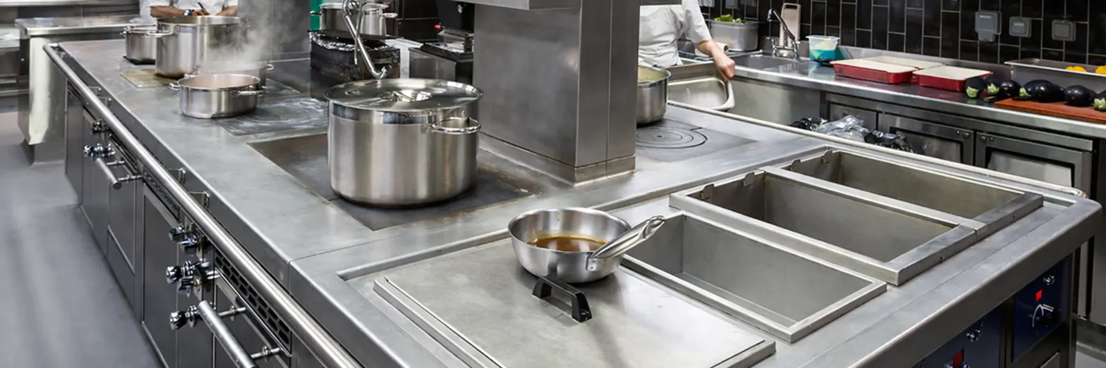 Cooking line with pans and wells at La Petite Maison