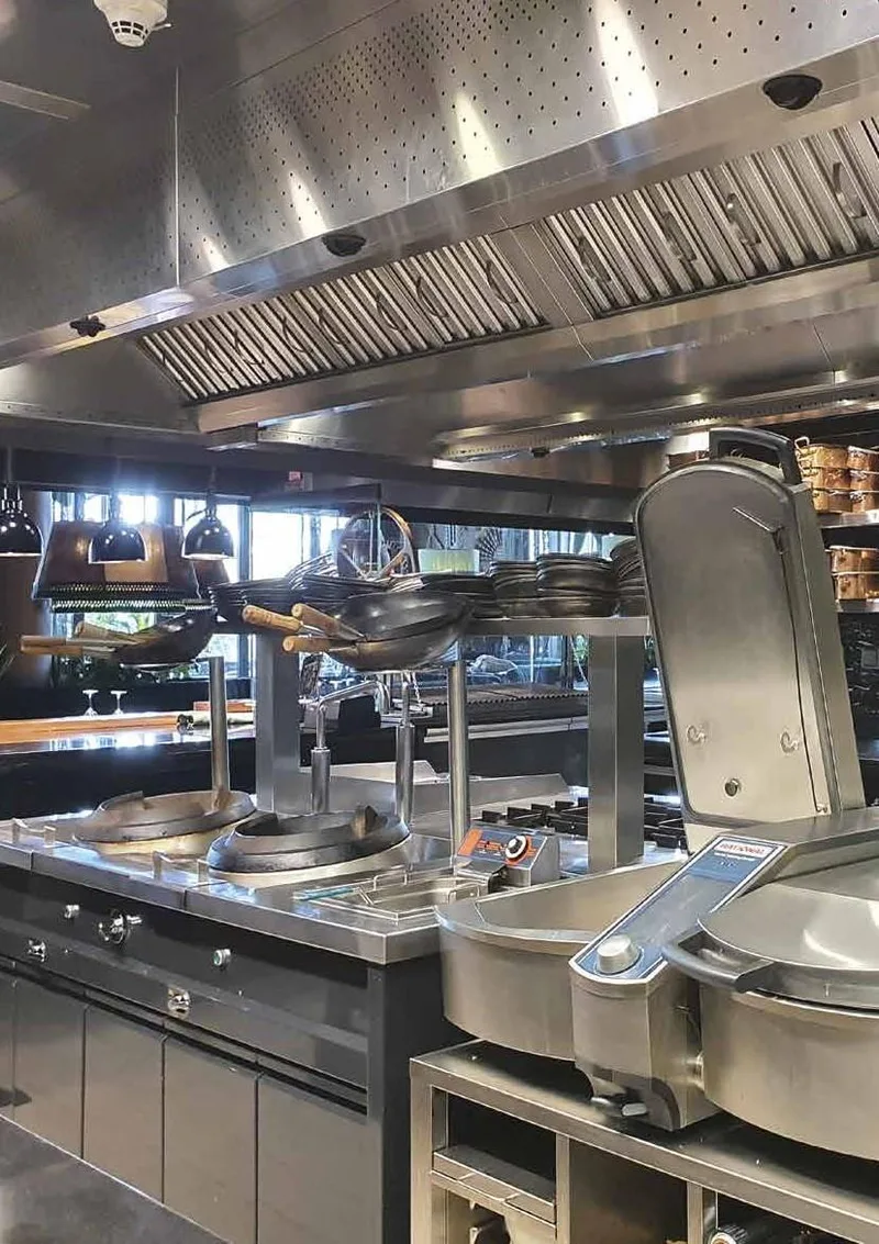 Cooking line with tilting kettle and wok burners at Amazonico DIFC