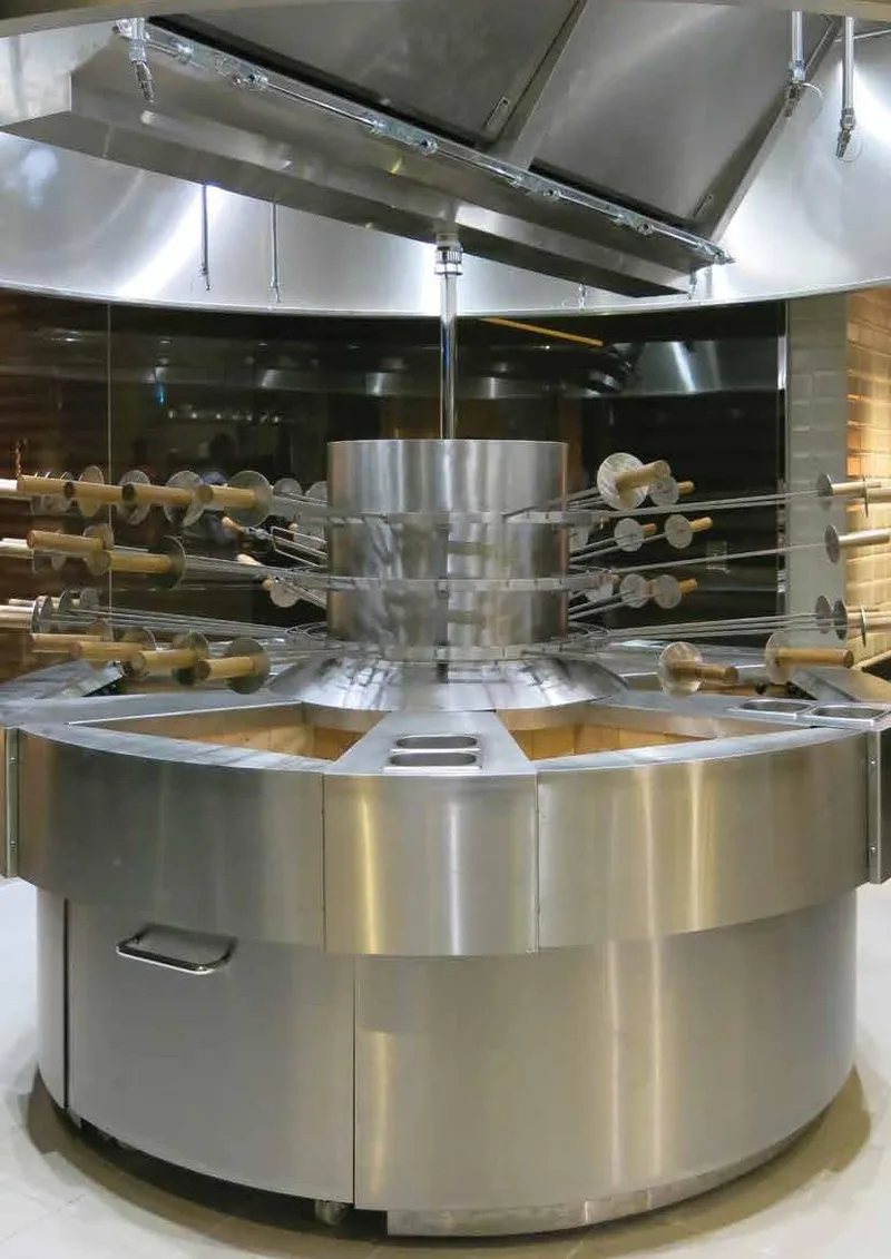 Stainless churrasco rotisserie station at Chamas, Crowne Plaza Dubai