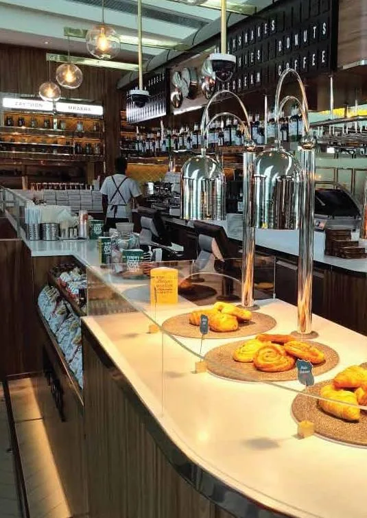 Bakery and coffee counter with heat lamps at Tranzeet